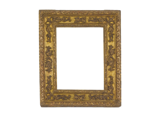 A Tuscan late 16th Century carved and gilded cassetta frame
