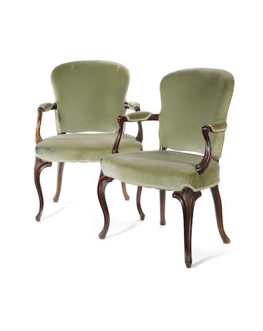 A pair of George III carved mahogany Open Armchairs in the manner of John Cobb, in the French taste
