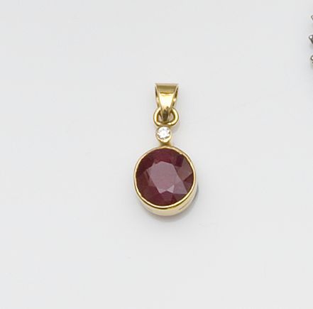 A ruby and diamond pendant