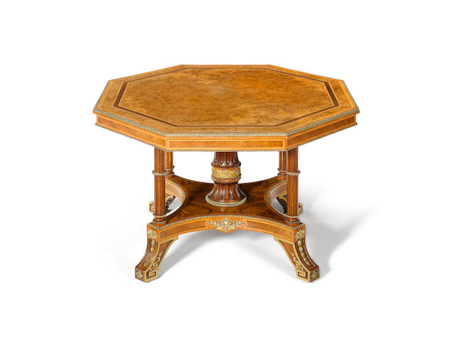 A Victorian burr walnut, tulipwood and harewood crossbanded centre table attributed to Holland & Sons