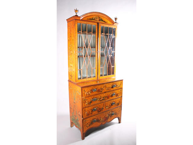A good Adam style satinwood, crossbanded and classical design polychrome painted secretaire bookcase, George III and later