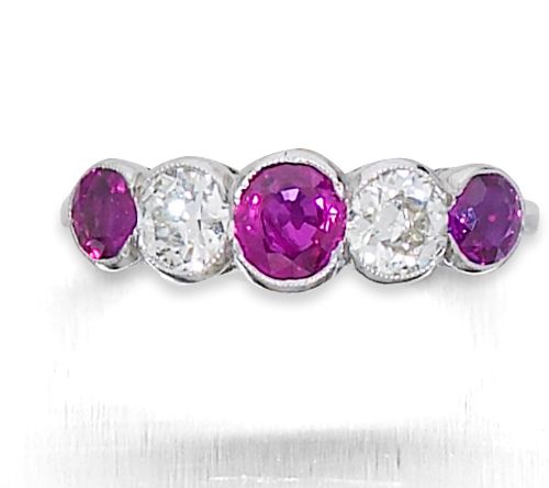 A ruby and diamond five stone ring