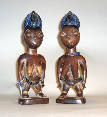 A pair of Yoruba female twin figures, Oyo, Nigeria 27cm high 2