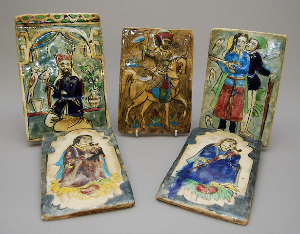 A group of five ceramic tiles