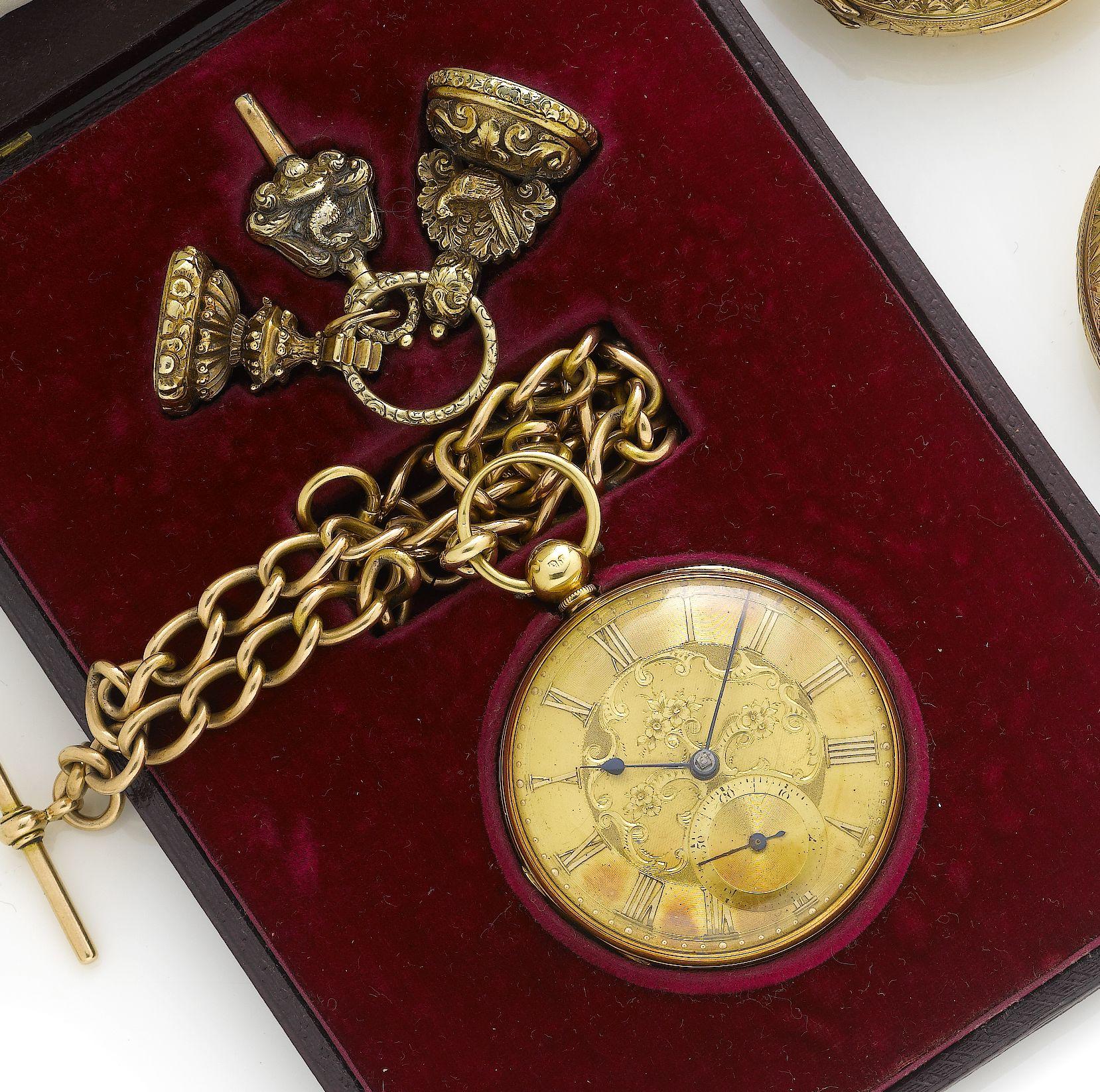 A mid 19th century 18ct gold open faced pocket watch with 15ct gold curb...