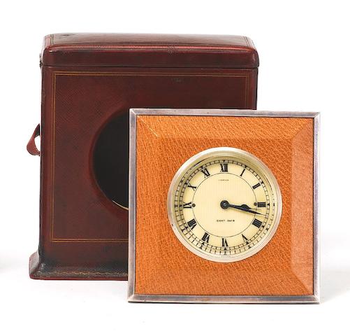 A 20th century white gold mounted leather travelling strut eight day timepiece in original presentation case Cartier, the rear cover numbered 0542