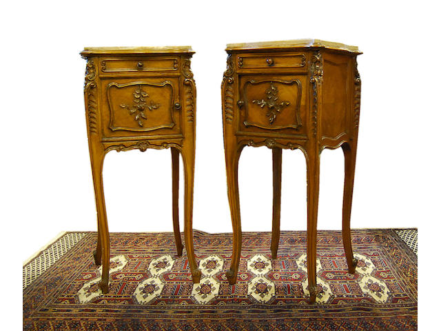 A pair of French carved walnut and quarter-veneered marble-topped night cabinets, late 19th Century