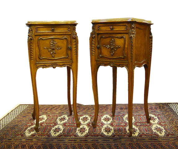 A pair of French carved walnut and quarter-veneered marble-topped night cabinets, late 19th Century