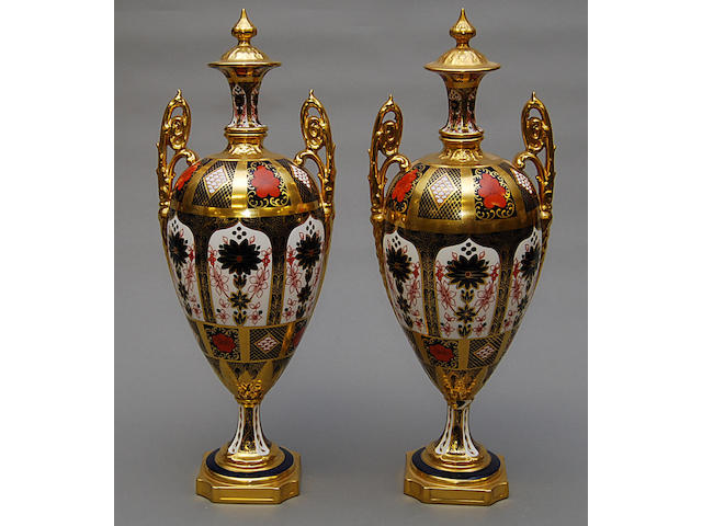 A large pair of Crown derby Imari vases