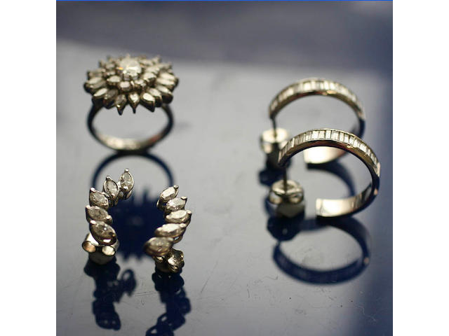 A diamond cluster ring and two pairs of diamond earrings