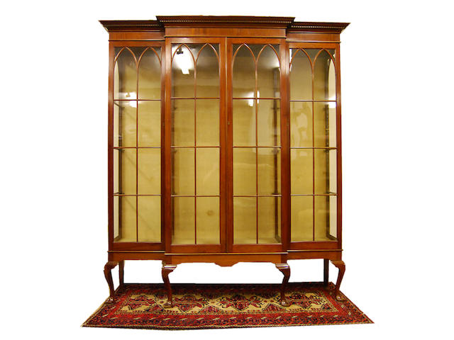 A mahogany and glazed breakfront display cabinet