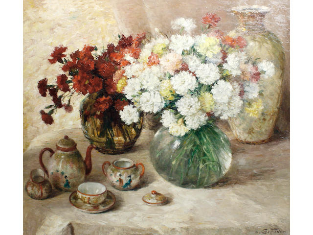 Aristide Goffinon (Belgian, 1881-1952) A still life of carnations and a tea set