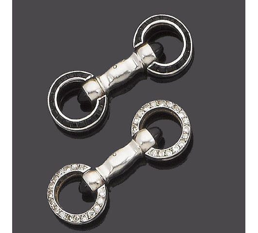 A pair of diamond and onyx cufflinks, by Cartier,