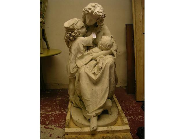 A large marble statue of a mother and two children