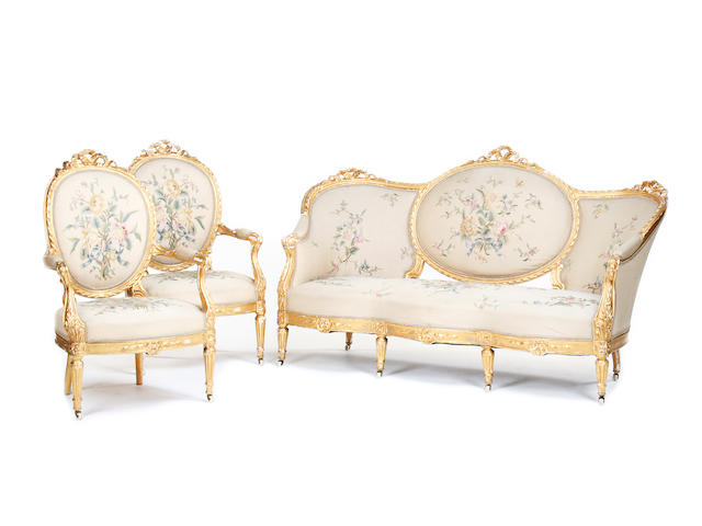An early 20th century French carved giltwood salon suite
