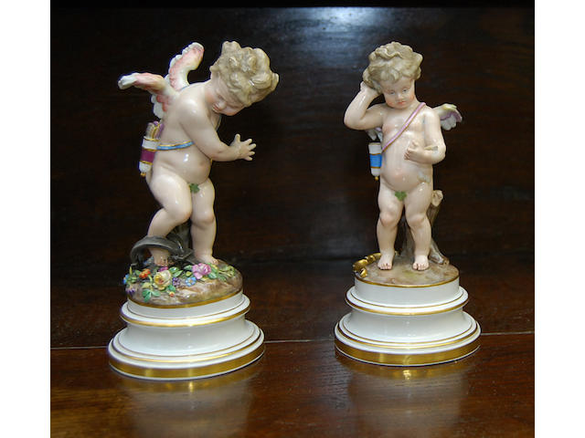 A pair of 19th Century Meissen putti figures
