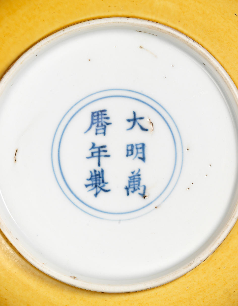 A pair of incised yellow-glazed dishes Wanli six-character marks and of the period