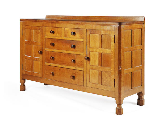 A 'Mouseman' oak sideboard excecuted in 1964, no longer in production,