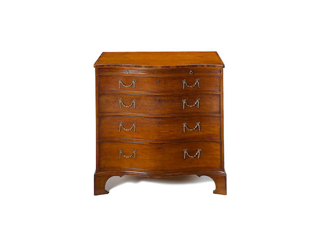 A George III mahogany and goncalo alves crossbanded serpentine Chest