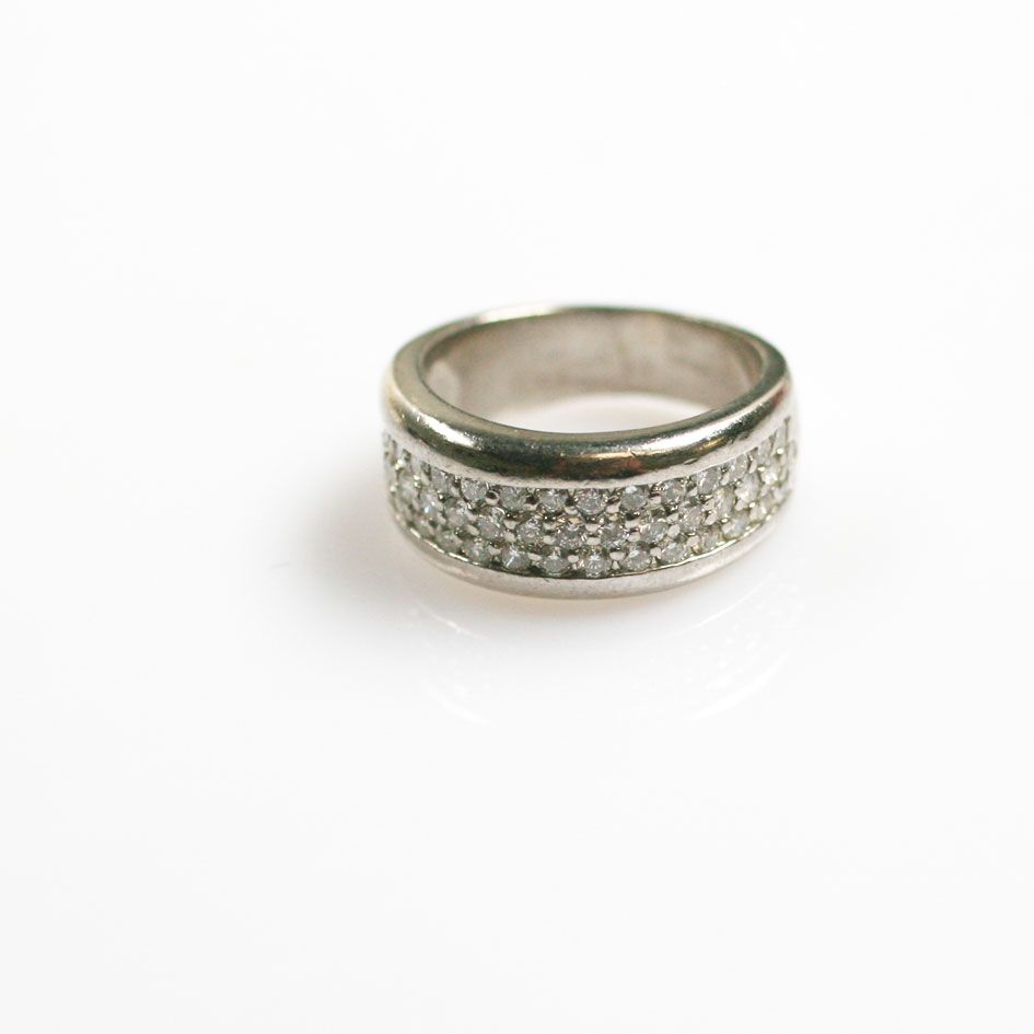 A diamond half hoop ring