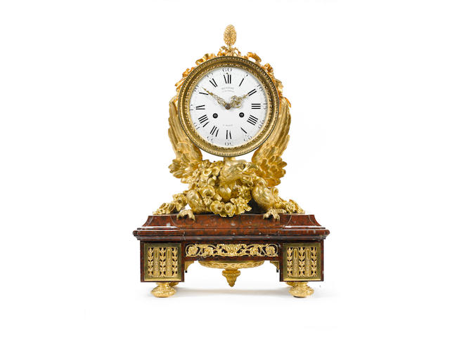 A French 19th century Louis XVI style gilt-bronze and Rouge Griotte marble mantel clock by Deni&#232;re, Paris
