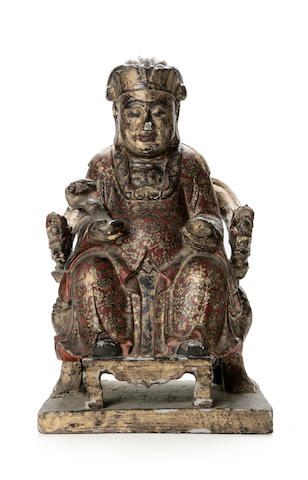 A painted and gilt decorated wood figure Ming