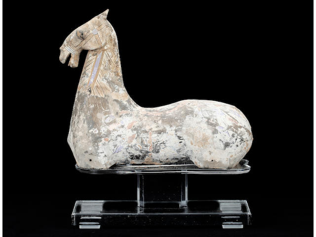 A Han type pottery head and torso of a horse25cm high, on a perspex stand, a similar terracotta horse and a similar horse with painted decoration. (3)