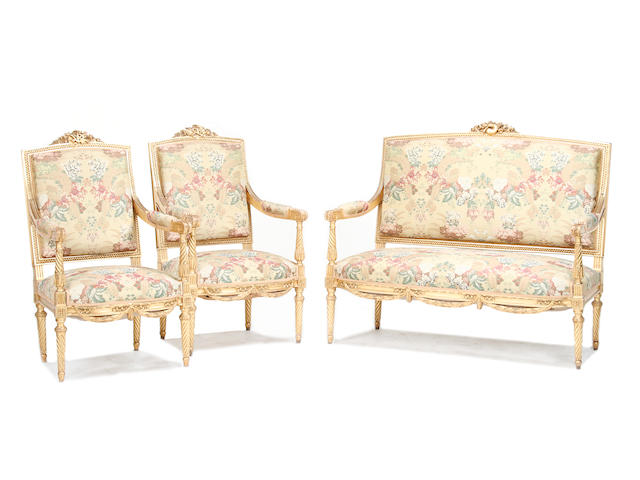 An early 20th century carved giltwood salon suite of Louis XVI style