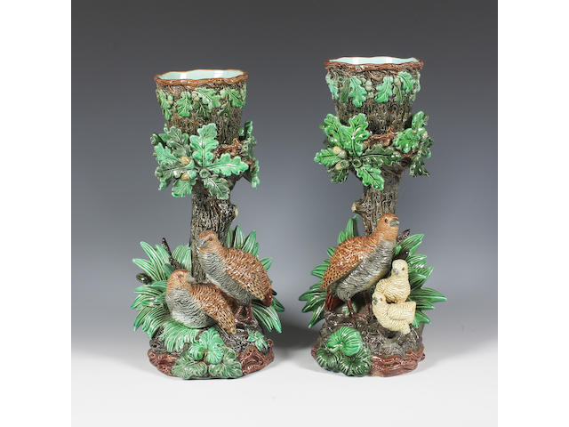 A pair of continental majolica cache pots and stands Late 19th-early 20th Century.