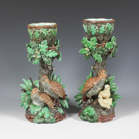 A pair of continental majolica cache pots and stands Late 19th-early 20th Century.