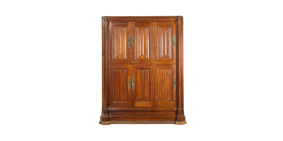 An impressive Gothic Revival oak locker cupboard attributed to A W N Pugin for Crace & Co.