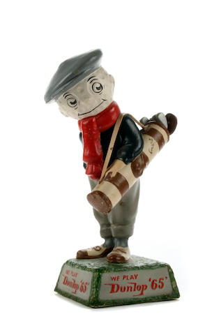 Bonhams : A very rare small Dunlop 65 Caddie point of sale figurine