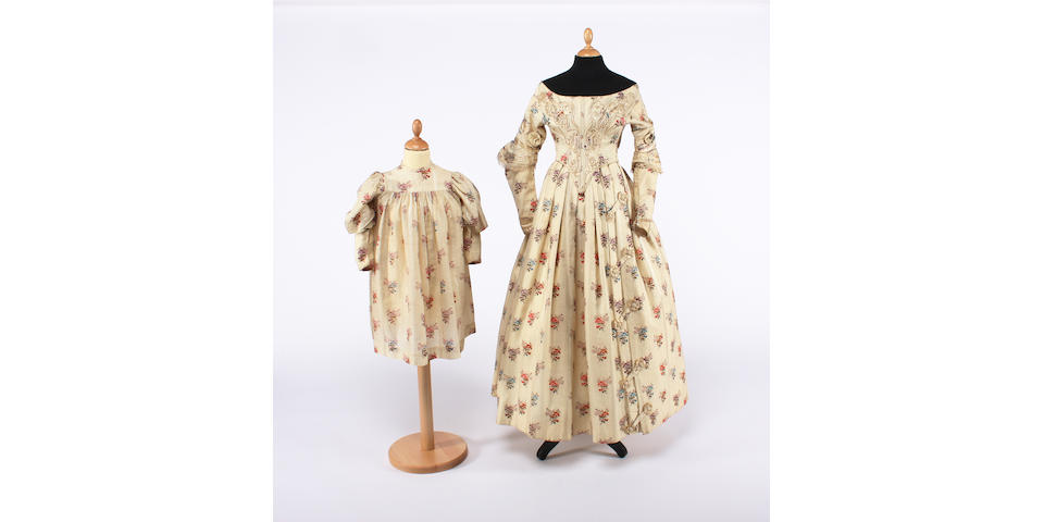A lady's mid 19th century floral dress, with a matching childs dress