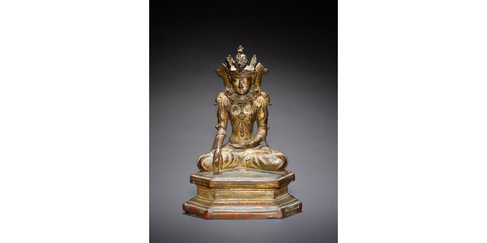 An Arakan gilded bronze, or other alloy, figure of a seated Buddhist Deity, possibly Avalokitesvara, The Bodhisattva of Compassion 17th century