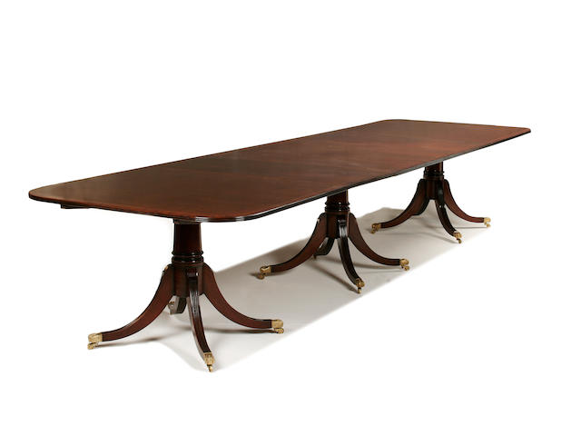 A George III style mahogany triple pedestal dining table