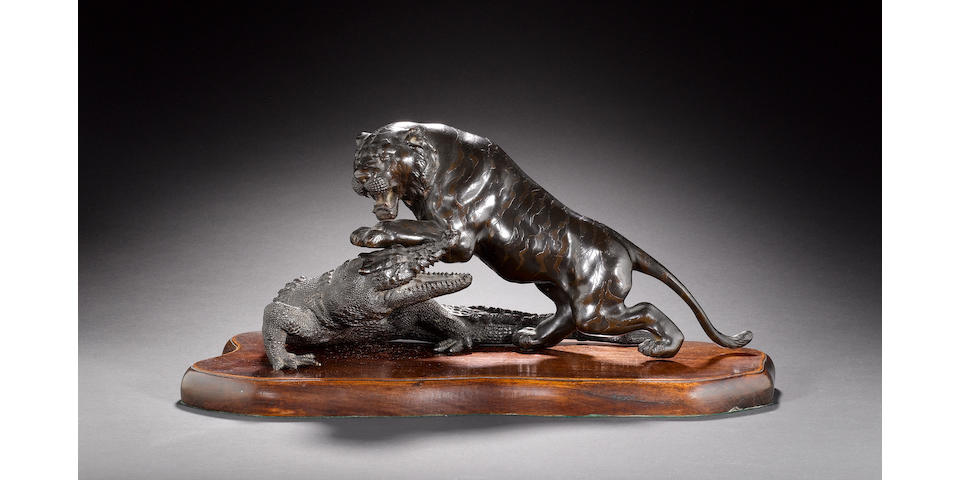 A bronze okimono of a fighting tiger and crocodile Meiji Period