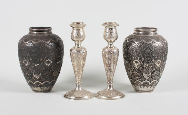 A pair of of Eastern metalware candlesticks With stamped marks  (4)