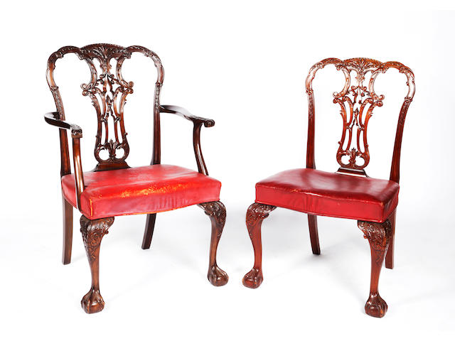 A set of ten Georgian style carved mahogany dining chairs