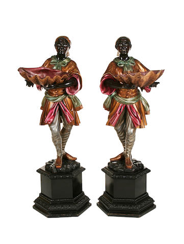 A pair of Venetian carved wood, gilded and polychrome decorated blackamoor figures