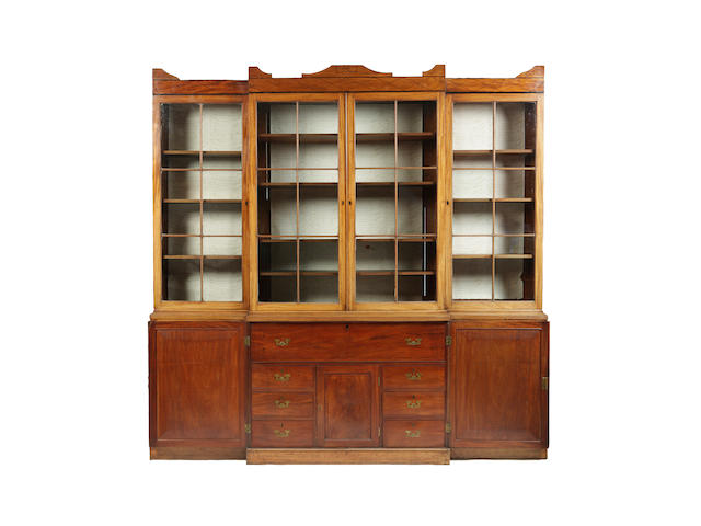 A Regency mahogany and ebony lined breakfront bookcase