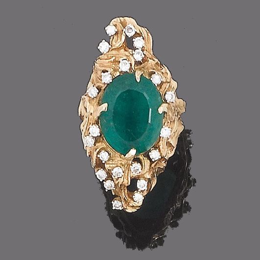 An emerald and diamond ring