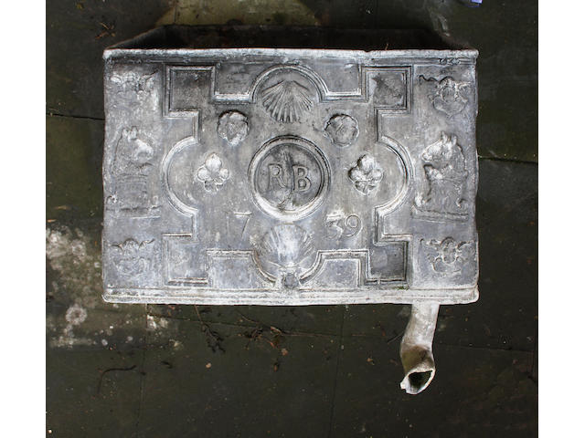 A small George II weathered lead cistern