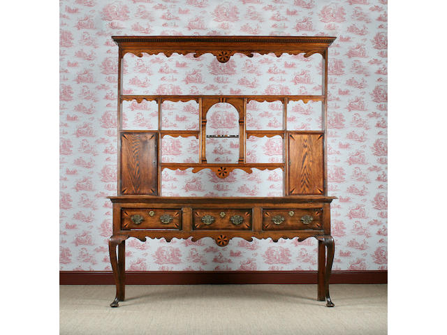 A mid-18th century and later inlaid oak dresser, West Midlands