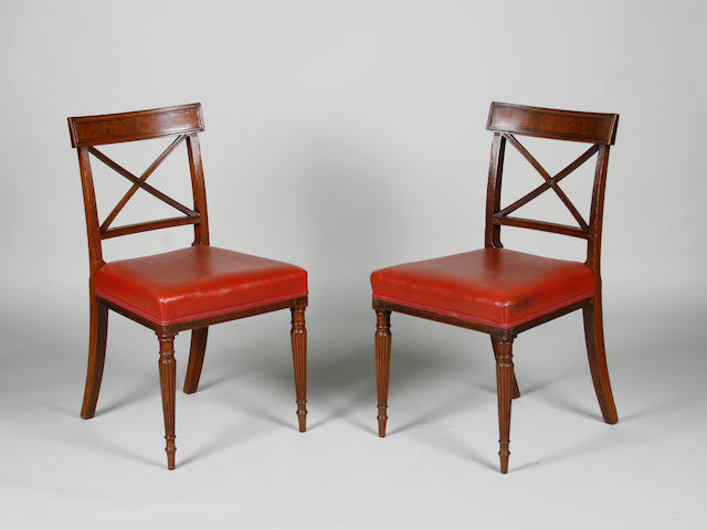 A set of ten 19th Century mahogany and ebony strung dining chairs