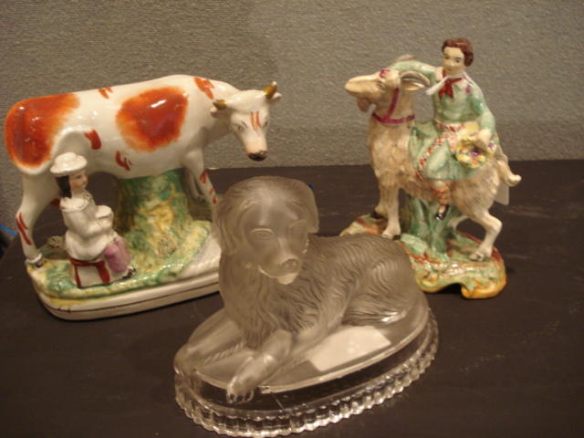 A Staffordshire group of a cow and milkmaid