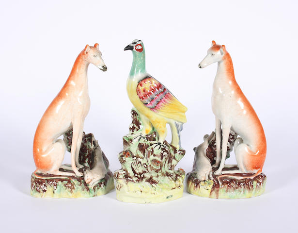 A pair of Staffordshire models of greyhounds and a pair of models of pheasants Circa 1860-70.