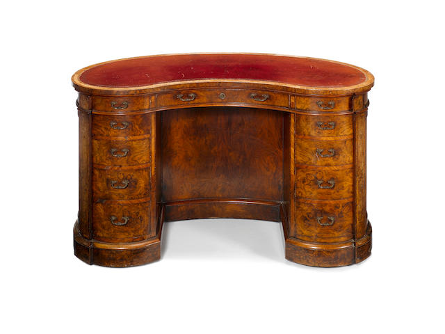 A Victorian burr walnut and kingwood banded kidney shaped Writing Desk by John Barrow for Gillows