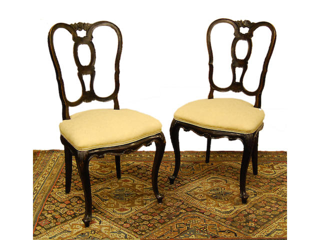 A set of eight Continental walnut dining chairs