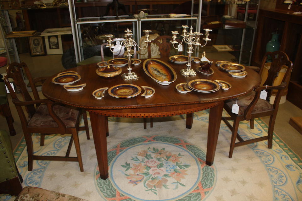 An Art Deco walnut and inlaid dining suite Circa 1930