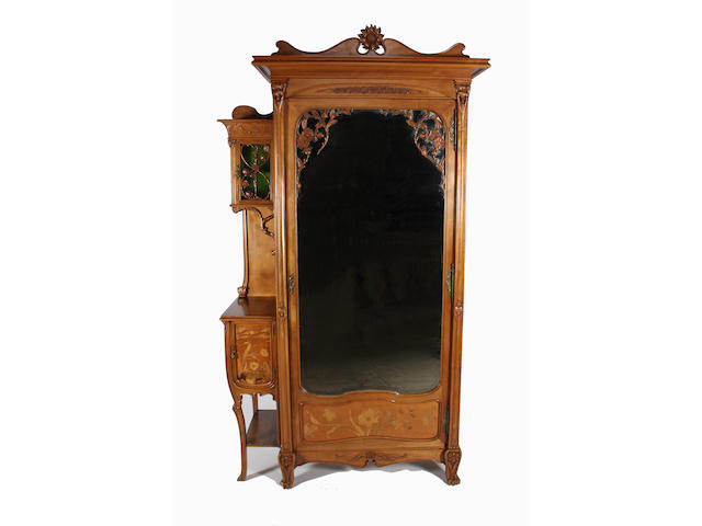 A good French Art Nouveau carved and inlaid walnut four piece bedroom suite in the Majorelle style, circa 1900